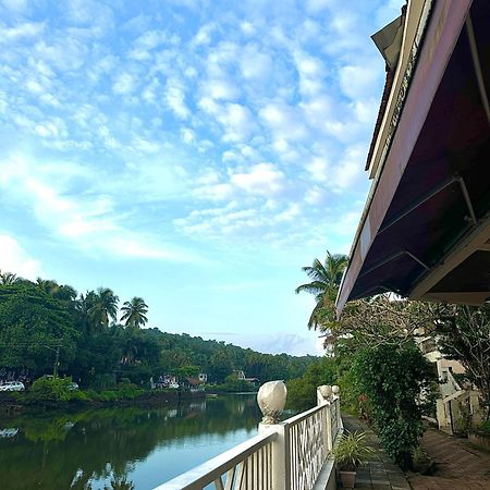Hotel Riverside Baga Bagian luar foto