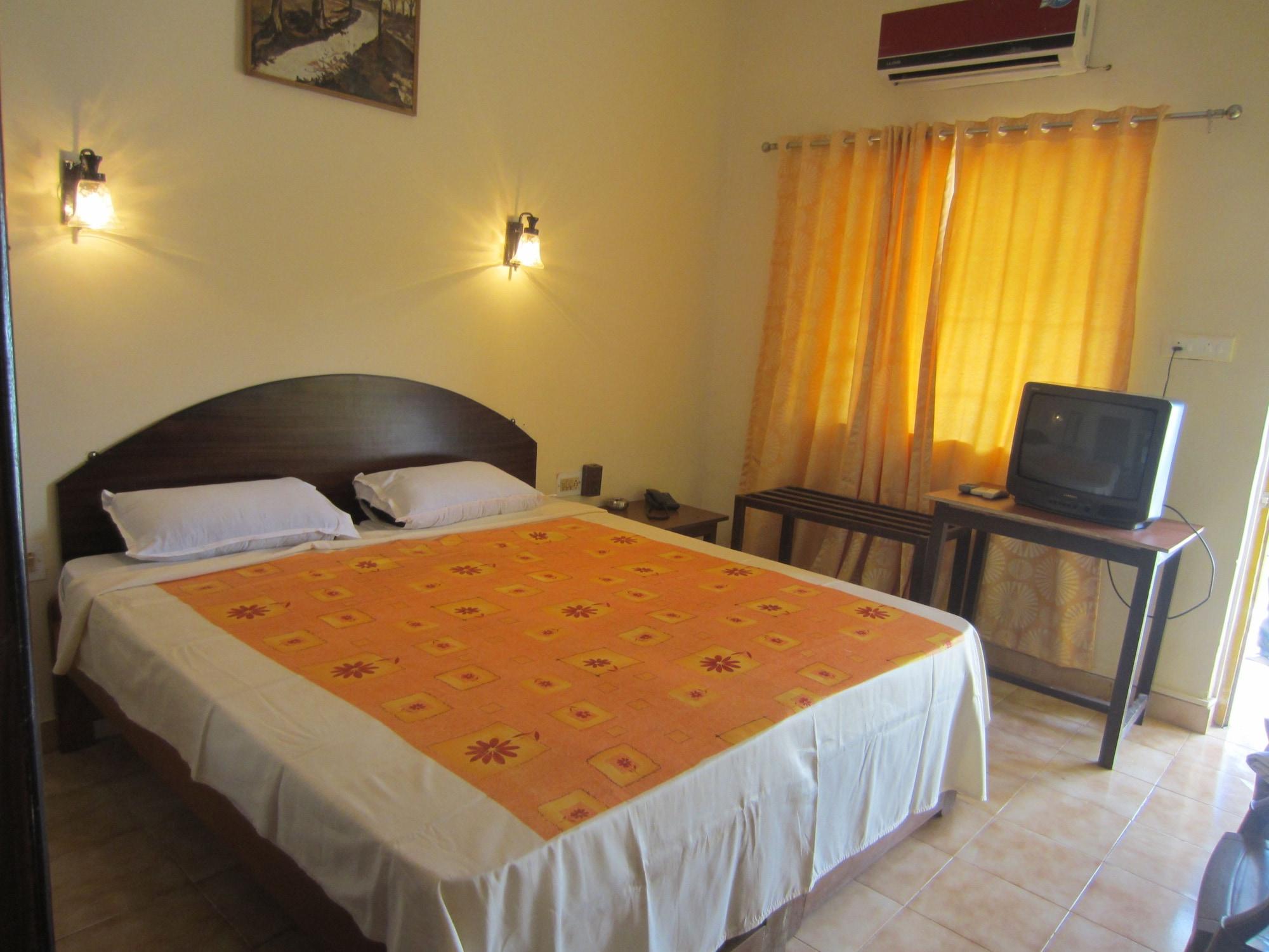Hotel Riverside Baga Bagian luar foto