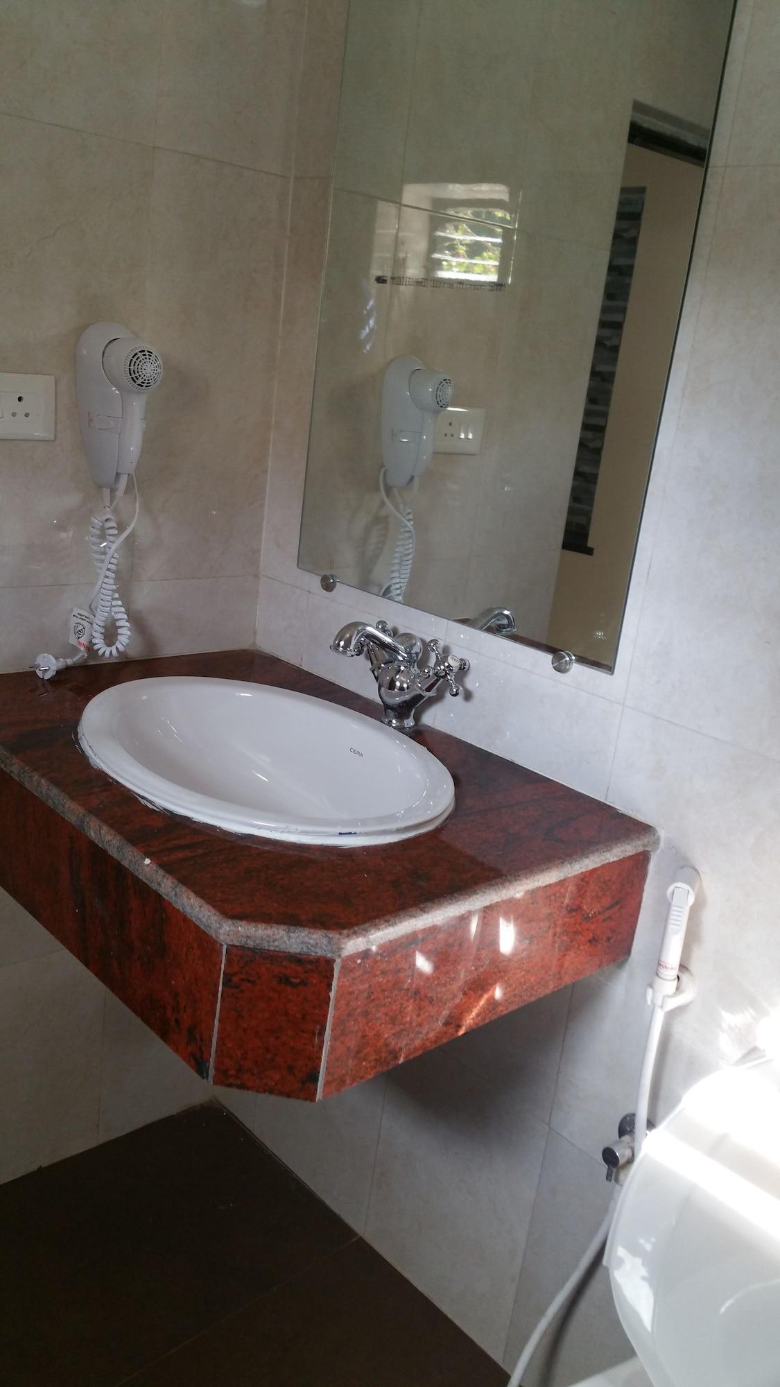 Hotel Riverside Baga Bagian luar foto