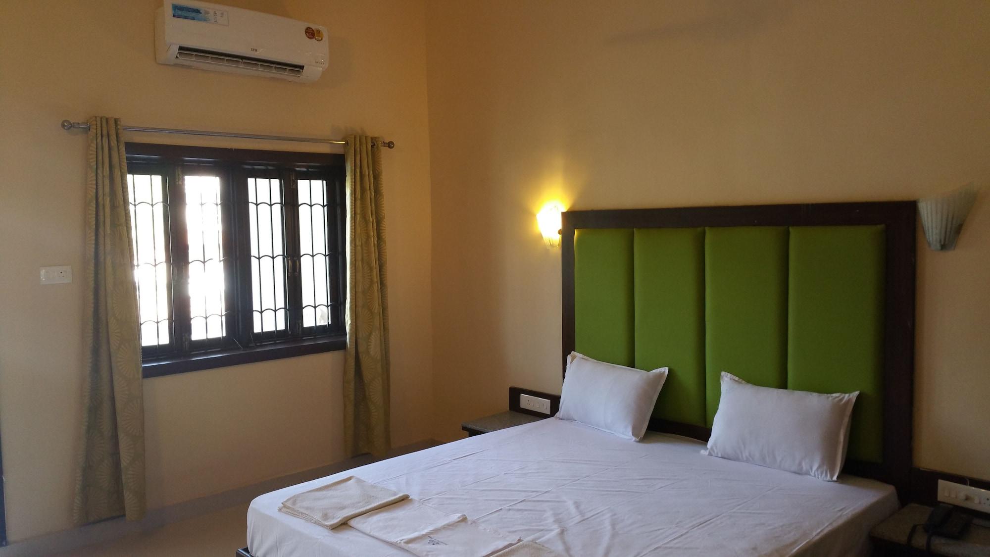 Hotel Riverside Baga Bagian luar foto
