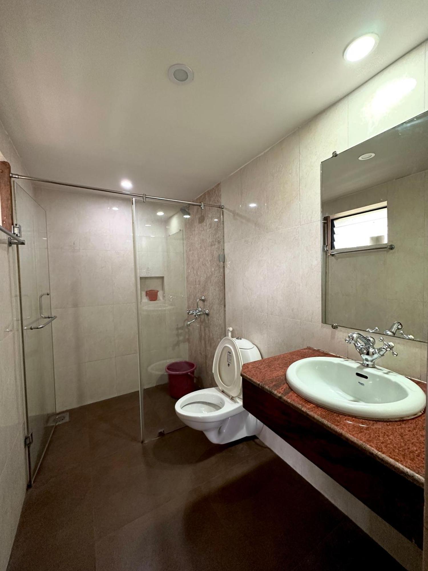 Hotel Riverside Baga Bagian luar foto