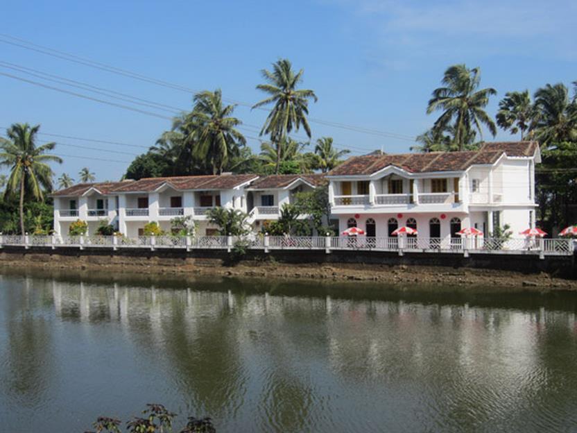 Hotel Riverside Baga Bagian luar foto