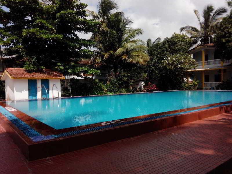 Hotel Riverside Baga Bagian luar foto